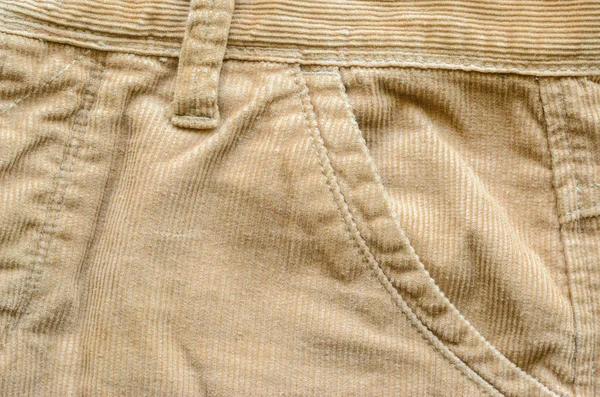 織物コーデュロイ パンツの背景として ズボンのポケット ベージュ ビロード服のテクスチャ — ストック写真