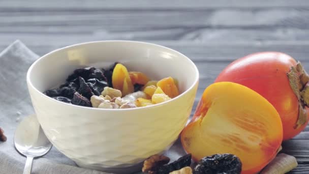 Oatmeal Deep Bowl Spoon Sticking Out Persimmon Dried Apricots Prunes — Stock Video