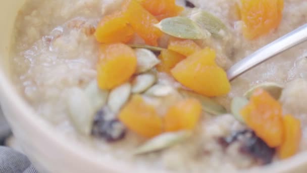 Oatmeal Dried Apricots Prune Pumpkin Seeds Deep Bowl Cooking Healthy — Stock Video
