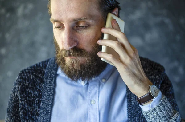 Bearded Man Received Bad News by Telephone