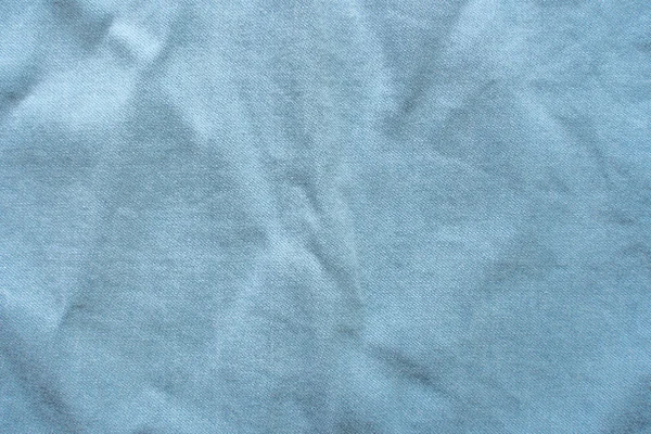 Texture of a blue slightly rumpled shirt — Stock Photo, Image