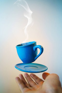 Mock up of soaring in the air cup of hot coffee clipart