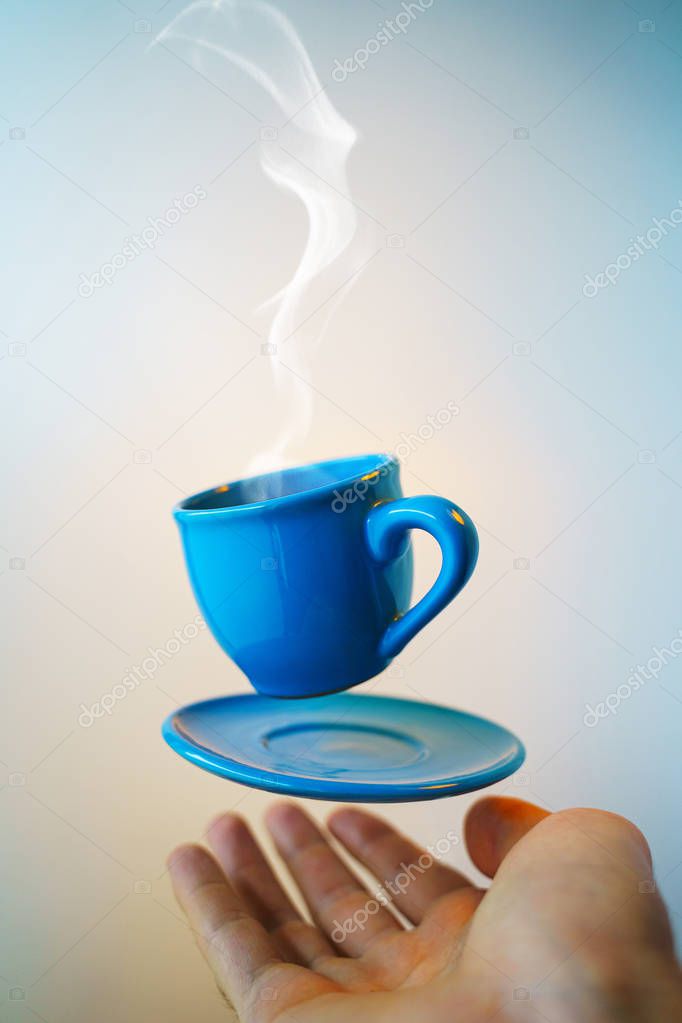 Mock up of soaring in the air cup of hot coffee