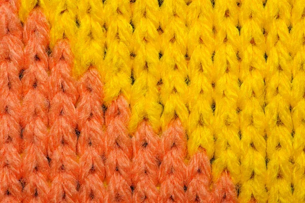 Textura de tecido de malha sintética amarela e vermelha — Fotografia de Stock