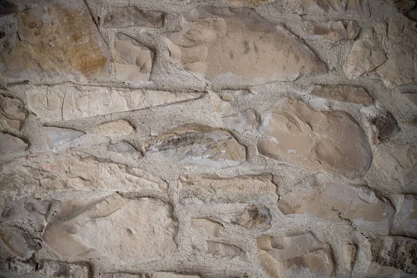 Kalıplaşmış ve yıpranmış Taş Duvar Yüzeyinin Yakın Görüntüsü
