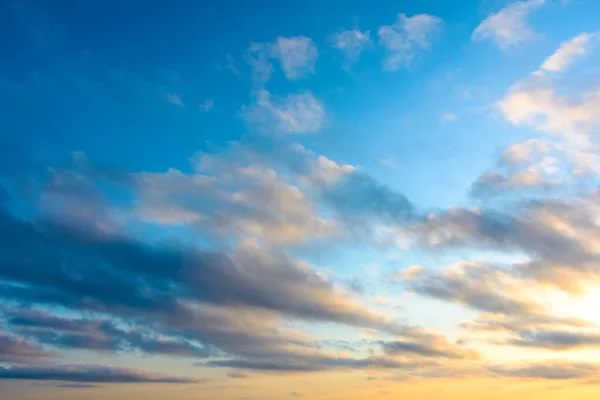 blue sky background with clouds. nature in summer at sunrise. dynamic cloudscape above horizon in morning light. nice image for beautiful outdoor wallpaper