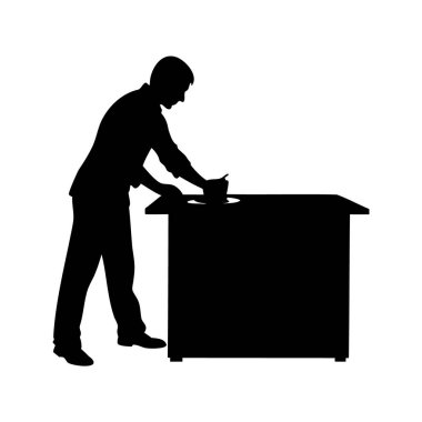 Masada çalışan bir adamın silüeti, muhtemelen elleriyle temizlik yapıyor, mutfak tezgahının silüetini temizliyor.