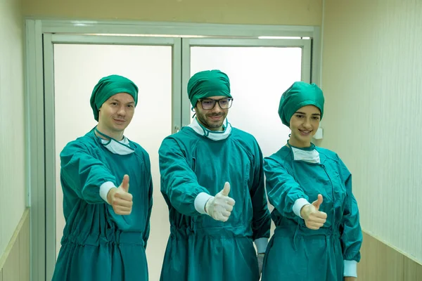 Team Positive Confident Proud Surgeons Standing Front Operating Room — Stock Photo, Image