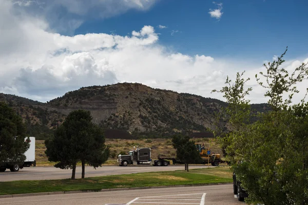 Trucks and cars are on the rest area among the mountains. Summer day parked in the mountains. Santa Fe Trail, Texas, USA