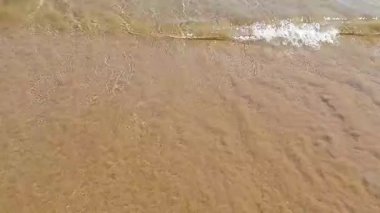 water waves on sand texture