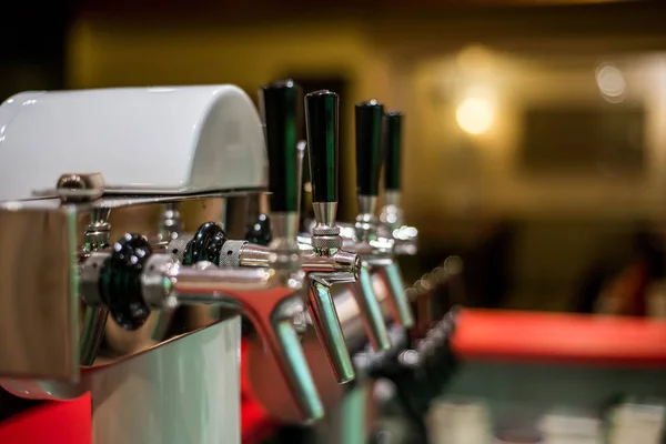 Close up draft beer and lemonade dispensing tower of bar restaurant — Stock Photo, Image