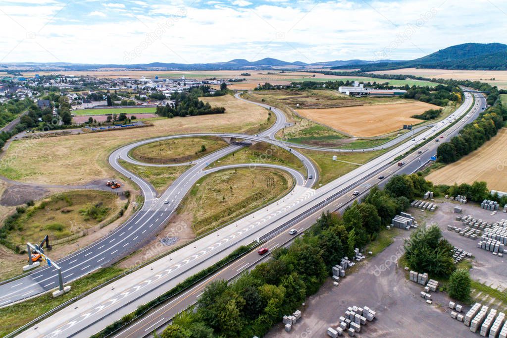 Aerial view of a highway intersection with a clover-leaf interchange Germany Koblenz