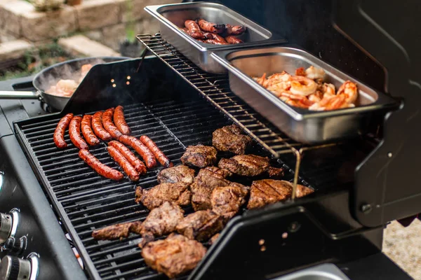 Barbecue grill bbq on propane gas grill steaks bratwurst sausages meat meal — Stock Photo, Image
