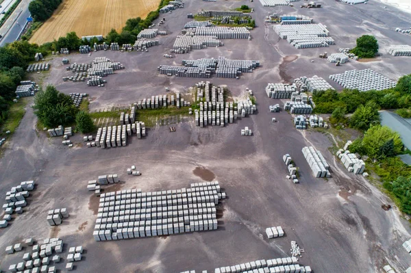 Aerial view of factory for Blocks of concrete stones Building materials industry products for homebuilding construction — Stock Image Aerial view of factory for Blocks of concrete stones Building materials industry products for homebuilding construction Stock Picture