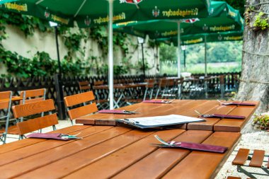 Koblenz Germany -28.07.2018 Picture of a typical empty German koenigsbacher beer garden in the town Koblenz clipart