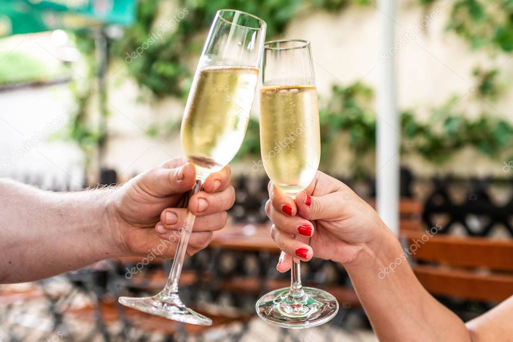 Celebration. People holding glasses of champagne making a toast