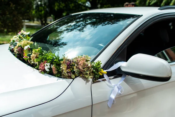 White Wedding car with Wedding decorations flowers Royalty Free Stock Images
