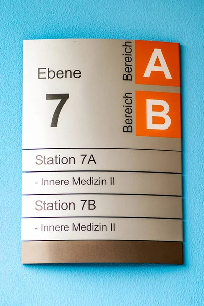 Sign indicating different internal medicine departments at hospital