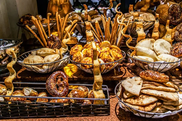 Bread bar station buffet catering, close-up Assortment of fresh pastry on table Pastry buffet set for breakfast in Egypt
