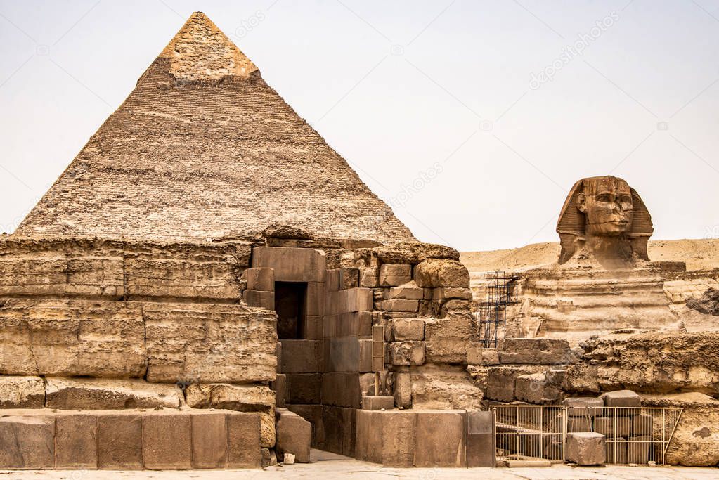 Egyptian Great Sphinx full body portrait head,with pyramids of Giza background Egypt empty with nobody. copy space