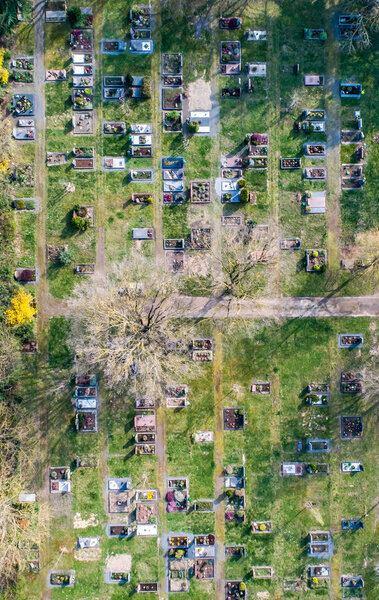 Aerial drone view of a church graveyard cemetary in Germany