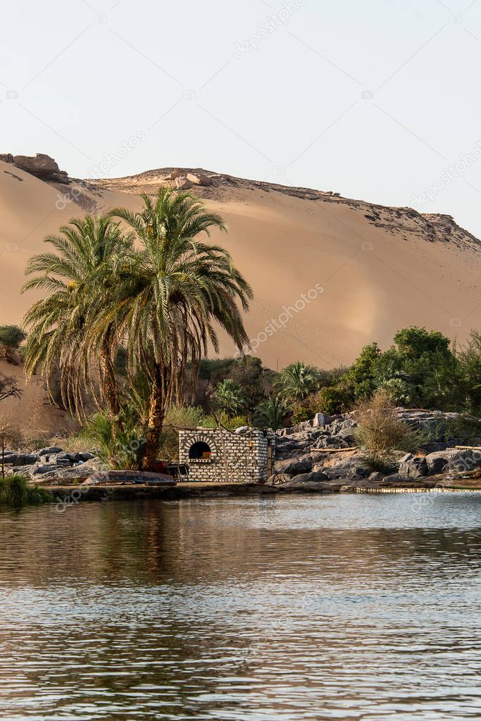 Sunset, Sand dunes on the Coastline of the Nile river part called First Cataract, Aswan Egypt