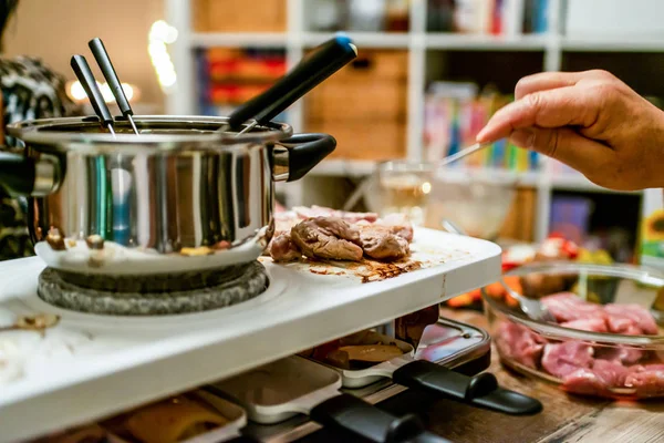 Swiss or Dutch raclette table filled with ingredients for a celebratory evening like Christmas or New Years Eve — Stock Photo, Image