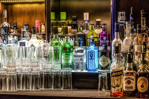 24.02.2019 Peking China - Wall with Bitters and Alcohols whiskey bar counter secrets ambient tlight blurent background — стокове фото