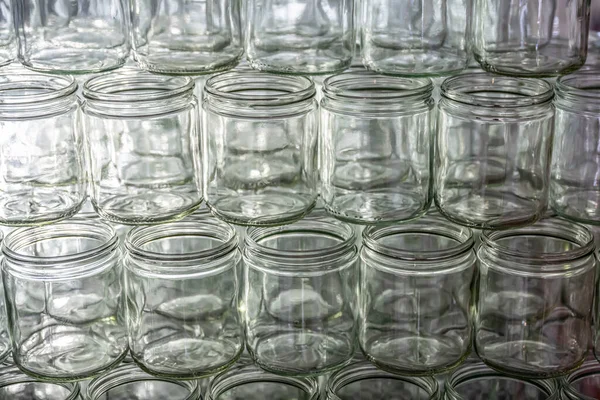 many glass jar empty glasses row for jam honey with lid caps abstract background bokeh