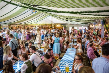 Koblenz Germany 27.09.2019 people party at Oktoberfest in europe during a concert Typical beer tent scene clipart
