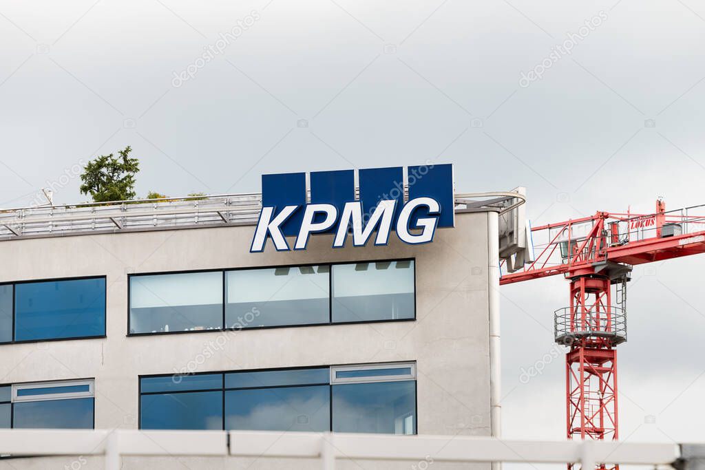PRAGUE, CZECHIA - 30. May 2025: KPMG logo sign of the accounting and advisory company. Close-up of the signage at an office building exterior. Financial services for business clients and companies.