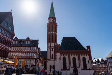 Police patrolling outside old church in Frankfurt old town square