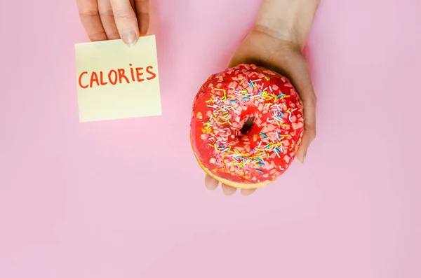 Woman Hand Holding Pink Donut Sprinkles Extra Calories Fat Fast — Stock Photo, Image
