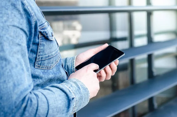 Close Up Hipster Business Man Using Smart Mobile Phone App Outdoor Black Oled Display Background Denim Jeans shirt Stylish Dressed