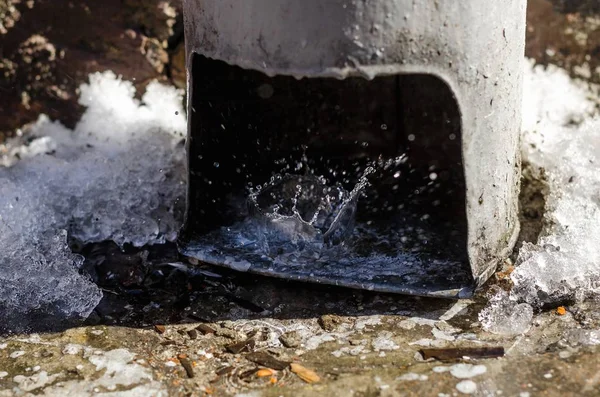 Tube leaking pipe old rusty drops snow rain leaks communally service