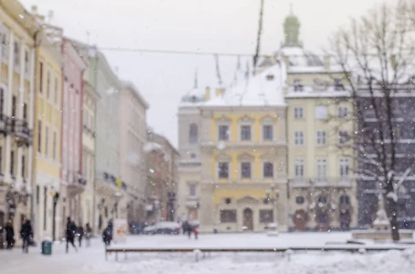 Blurred winter background city life bad weather lifestyle blizzard christmas cold falls snow tourists panorama old city