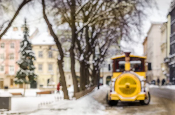 Blurred winter background city tourist train tour excursion New Year faritale Christmas Miracle holiday mood atmosphere lifestyle blizzard cold falls snow panorama old city