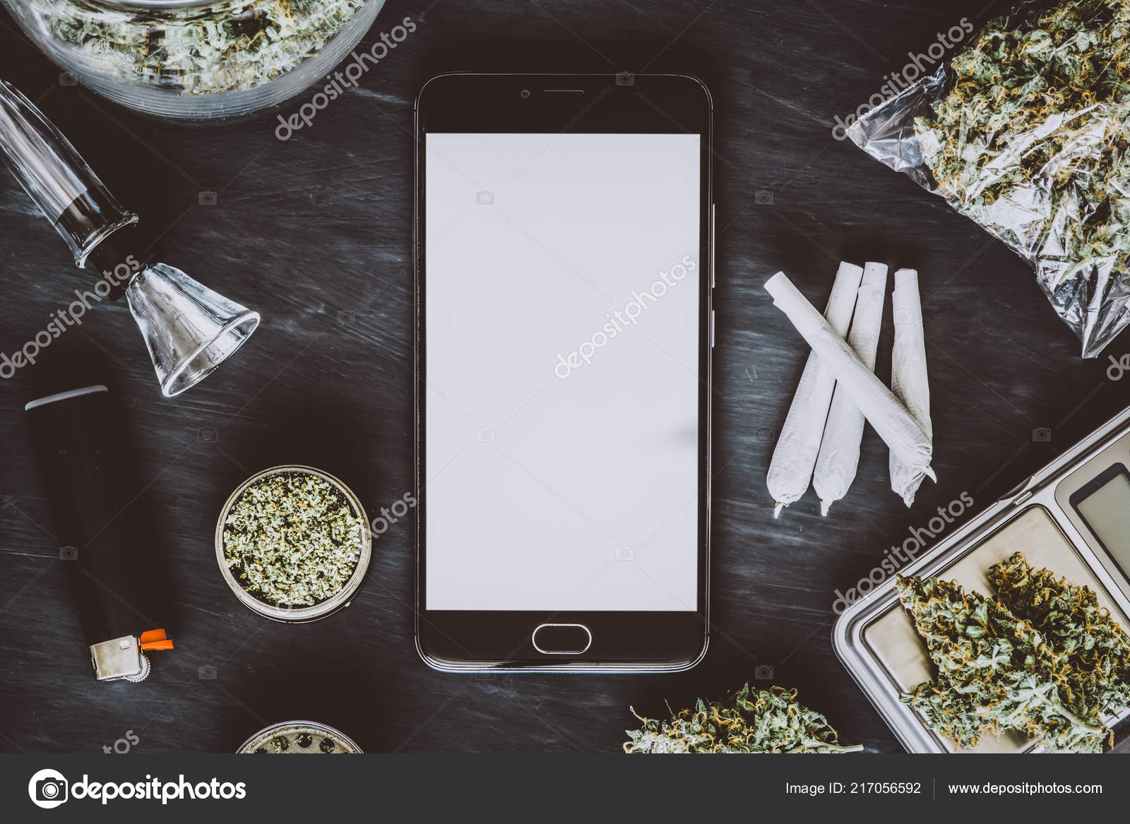 Download Smartphone With White Screen For Mockup Cannabis Buds On The Scales Lie On The Table With A Grinder Joint And Smartphone Marijuana In The Package Dark Background Top View Royalty Free Photo