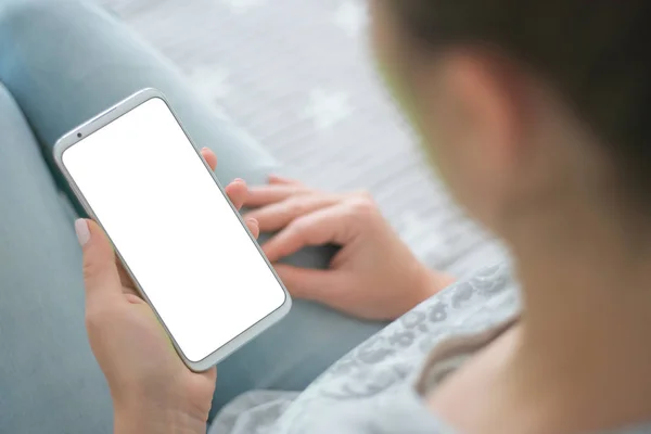 woman's hands Mockup image of smart phone. close up. chroma key. holding mobile phone white screen smartphone.