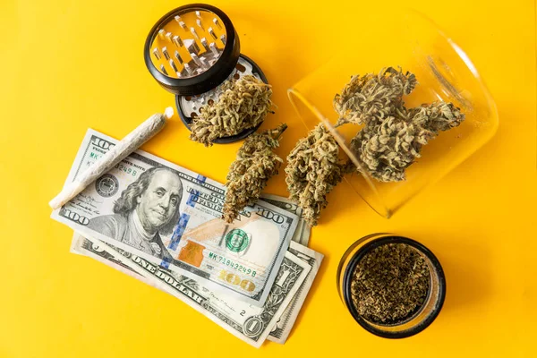 Cannabis money black market. Cannabis in Economics. Joint weed. Sativa THC CBD. Indica medical health. Marijuana weed bud and grinder. Marijuana bud and banknotes of dollars. Money weed.