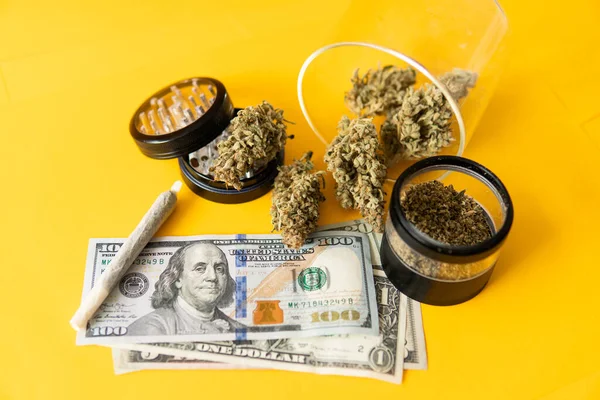 Cannabis money black market. Cannabis in Economics. Money weed. Sativa THC CBD. Joint weed. Marijuana weed bud and grinder. Indica medical health. Marijuana bud and banknotes of dollars.
