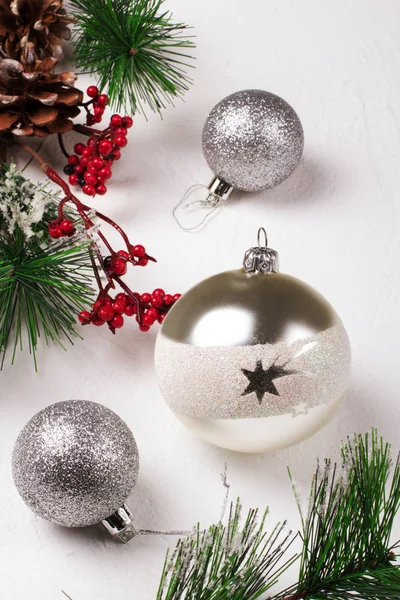 Silver balls on a white background. Christmas background.