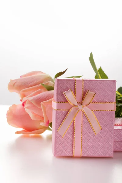 Pink box and roses. Valentine\'s Day. White background