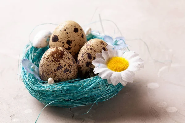 Easter eggs in a basket with flowers.
