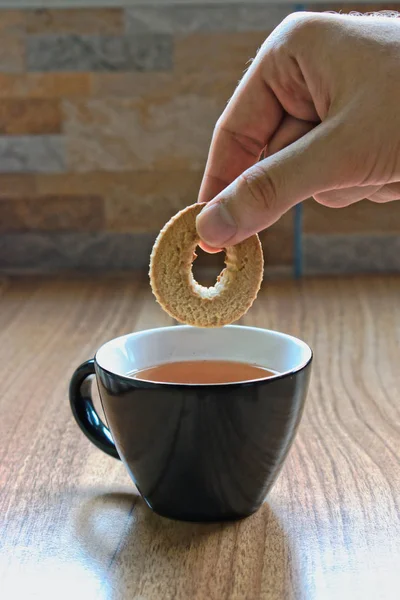 Hand Dipping Cookie Cup Tea — Stock Photo, Image