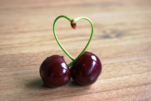 Cherries Heart Shaped Stems Wooden Table — Stock Photo, Image