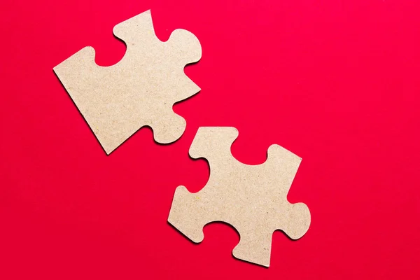 Two puzzles on a red background. — Stock Photo, Image
