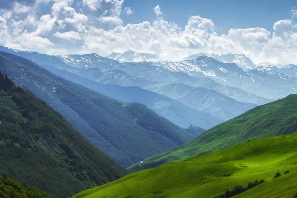 Mountains nature landscape on sunny summer day. Mountains ranges in Svaneti, Georgia. Scenery Hills and mountain. Amazing mountain range. Alpine. Green meadow covered by grass in highlands — Stock Photo, Image