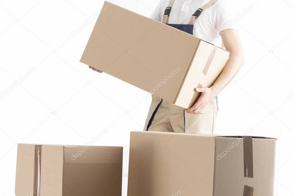 Delivery man puts cardboard box. Relocation service concept. Loader with box. Mover in uniform.