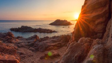 Beach in Costa Brava at sunrise. Cala de Boadella platja in Lloret de Mar on clear morning